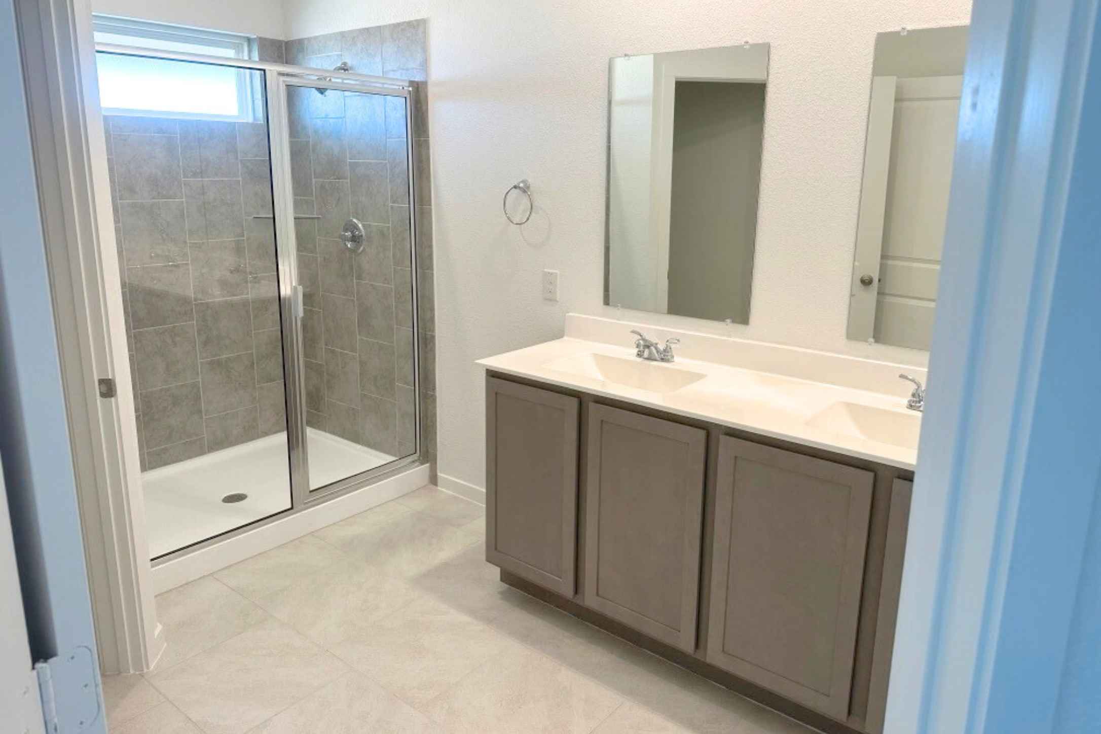 13832 Scarlett Song Drive Elgin, TX 78621 - Photo 8 of 19 Bathroom with double vanity and a stall shower