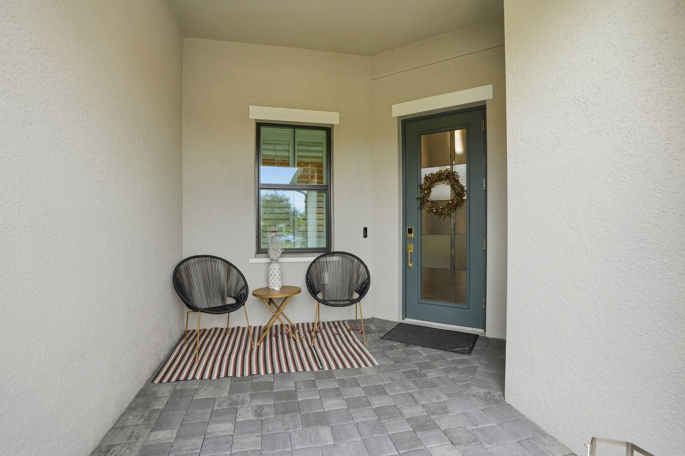 14708 Kingfisher Loop Naples, FL 34120 - Photo 3 of 42 a view of a door and chair in the room