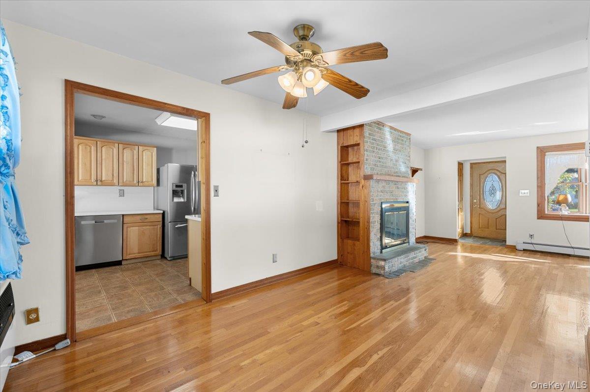 3 Surrey Lane Bethpage, NY 11714 - Photo 13 of 33 a view of a kitchen with a sink hardwood floor and a cabinet
