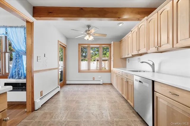 a view of a kitchen with a sink and windows