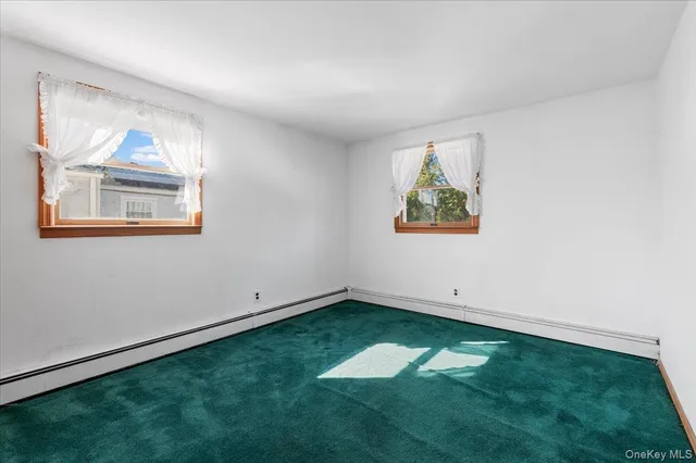 a view of room with window and hallway