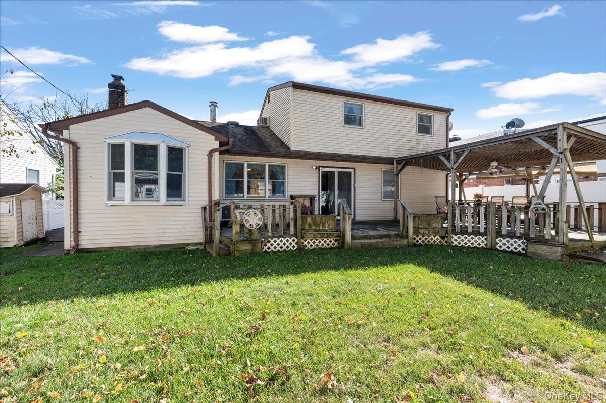 3 Surrey Lane Bethpage, NY 11714 - Photo 27 of 33 a front view of a house with garden