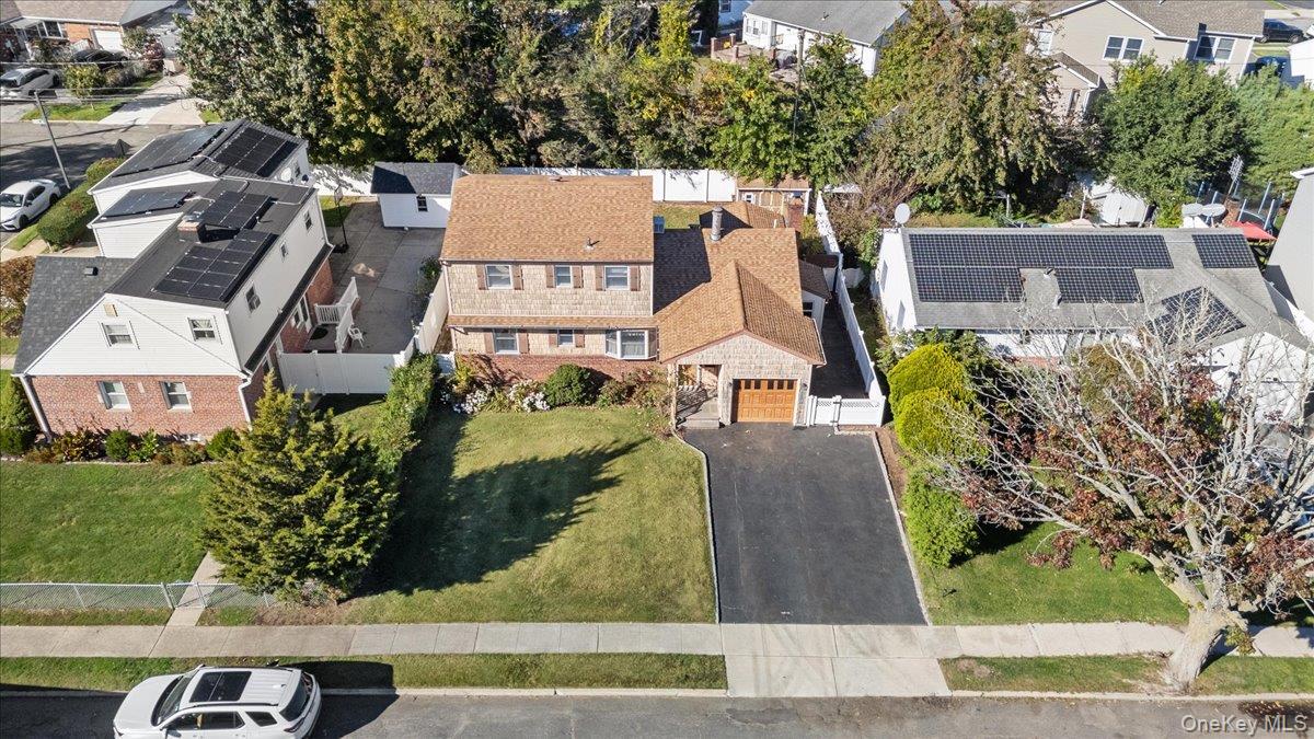 3 Surrey Lane Bethpage, NY 11714 - Photo 28 of 33 an aerial view of a house with a garden