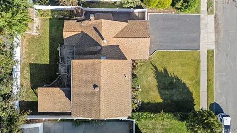 an aerial view of a house with swimming pool