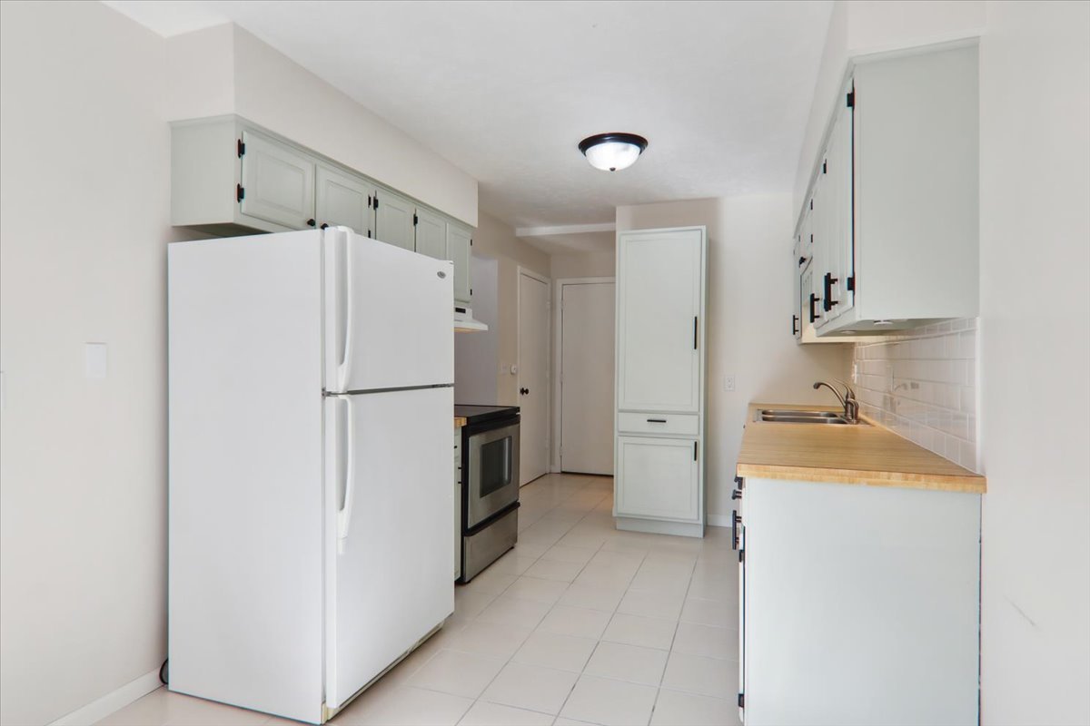 1544 Hunt Drive, Unit D Normal, IL 61761 - Photo 5 of 18 a kitchen with stainless steel appliances a refrigerator and a stove