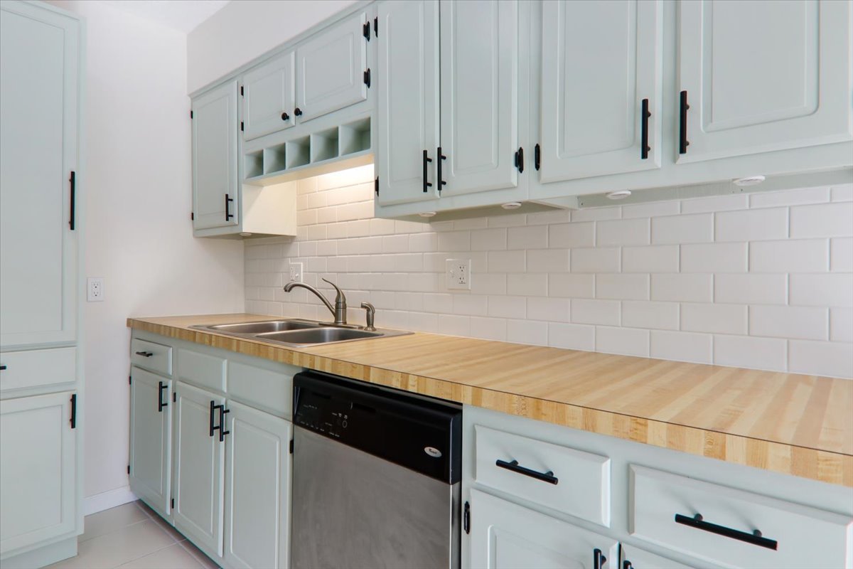 1544 Hunt Drive, Unit D Normal, IL 61761 - Photo 7 of 18 a kitchen with stainless steel appliances granite countertop white cabinets and a sink