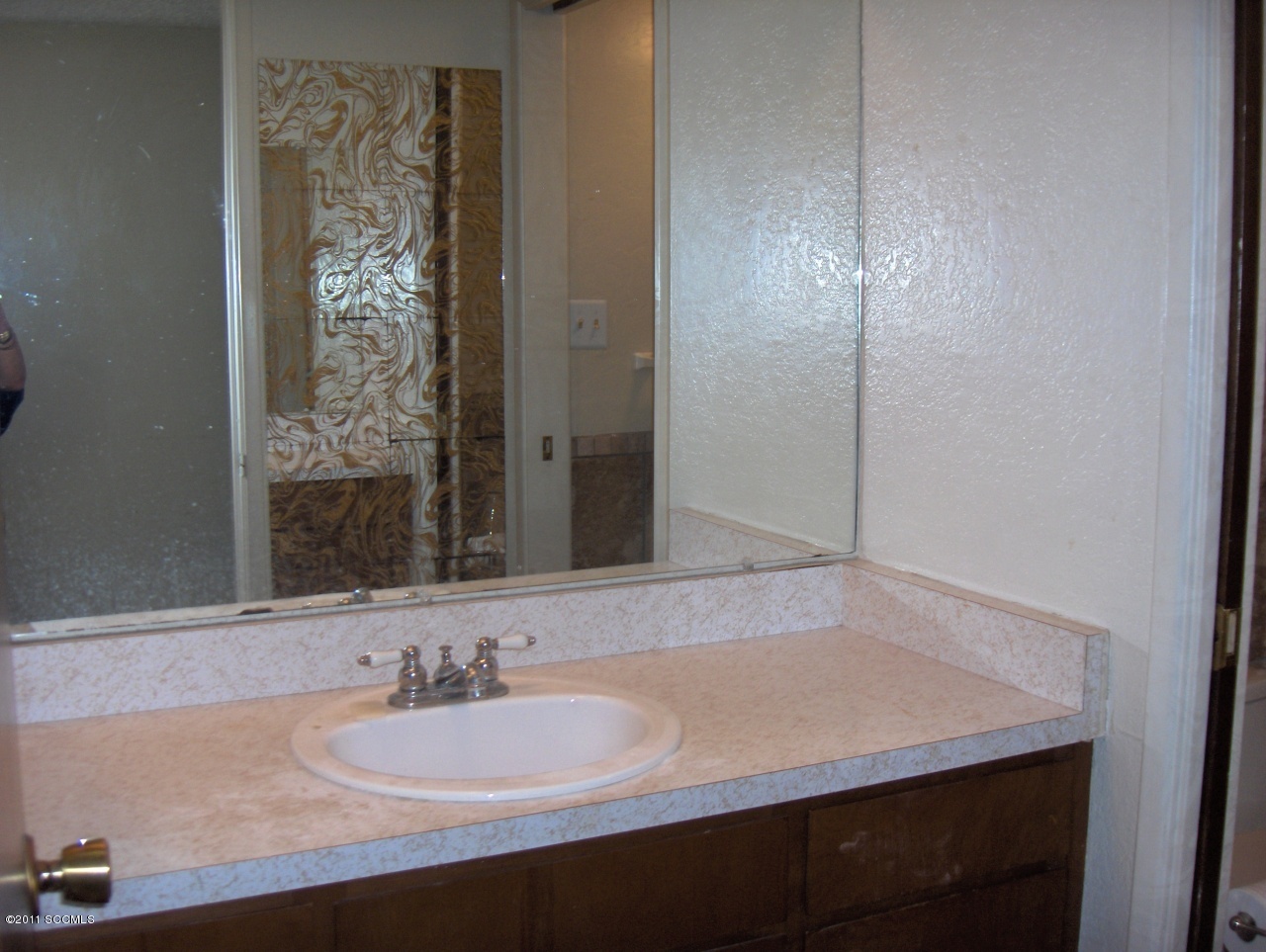 398 Poston Street Rio Rico, AZ 85648 - Photo 6 of 10 a bathroom with a sink and a mirror