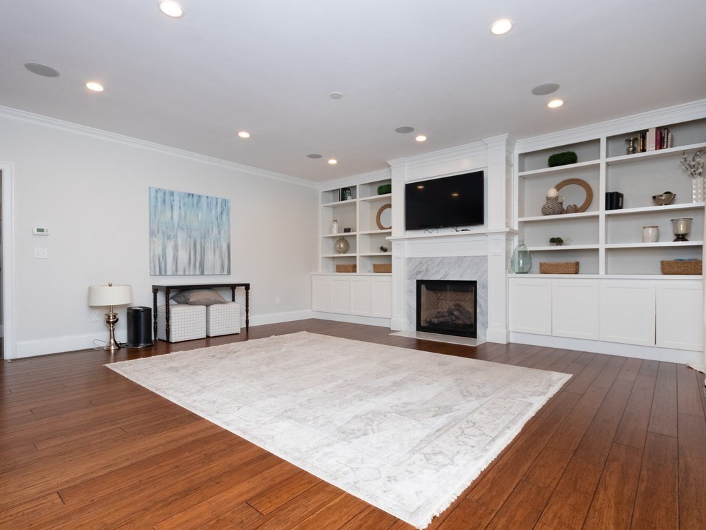 7 Garrett Spillane Road Foxboro, MA 02035 - Photo 12 of 36 a view of a livingroom with an empty space and a fireplace