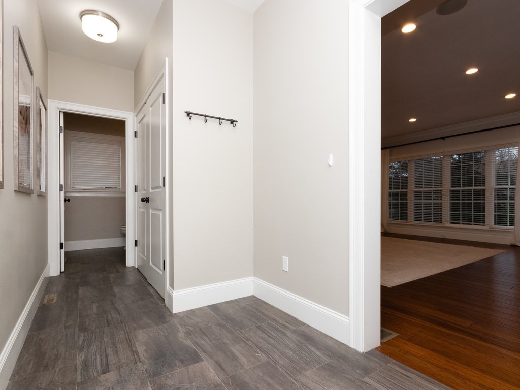 7 Garrett Spillane Road Foxboro, MA 02035 - Photo 16 of 36 an empty room with wooden floor and entrance