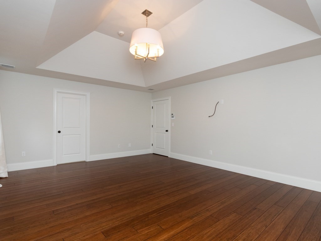 7 Garrett Spillane Road Foxboro, MA 02035 - Photo 19 of 36 a view of wooden floor and chandelier in a room