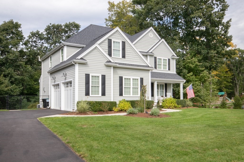 7 Garrett Spillane Road Foxboro, MA 02035 - Photo 2 of 36 a front view of a house with a garden
