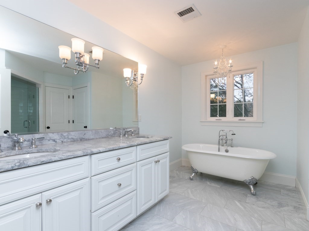 7 Garrett Spillane Road Foxboro, MA 02035 - Photo 21 of 36 a spacious bathroom with a double vanity sink mirror and a bathtub