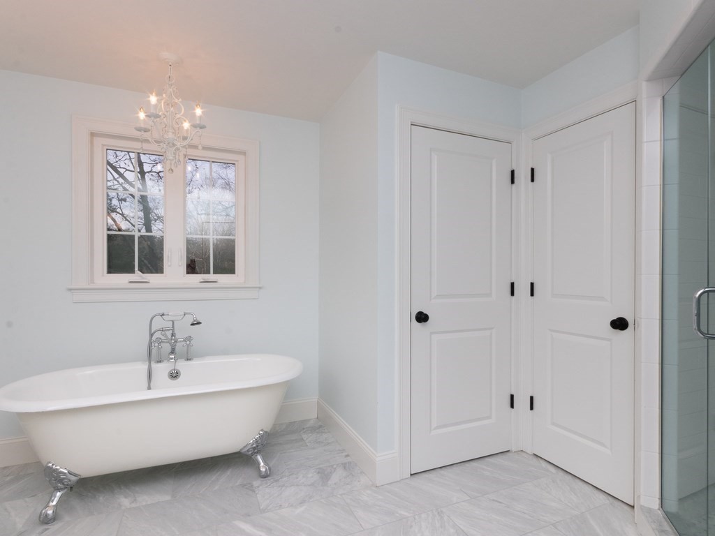 7 Garrett Spillane Road Foxboro, MA 02035 - Photo 23 of 36 a spacious bathroom with a bathtub and shower