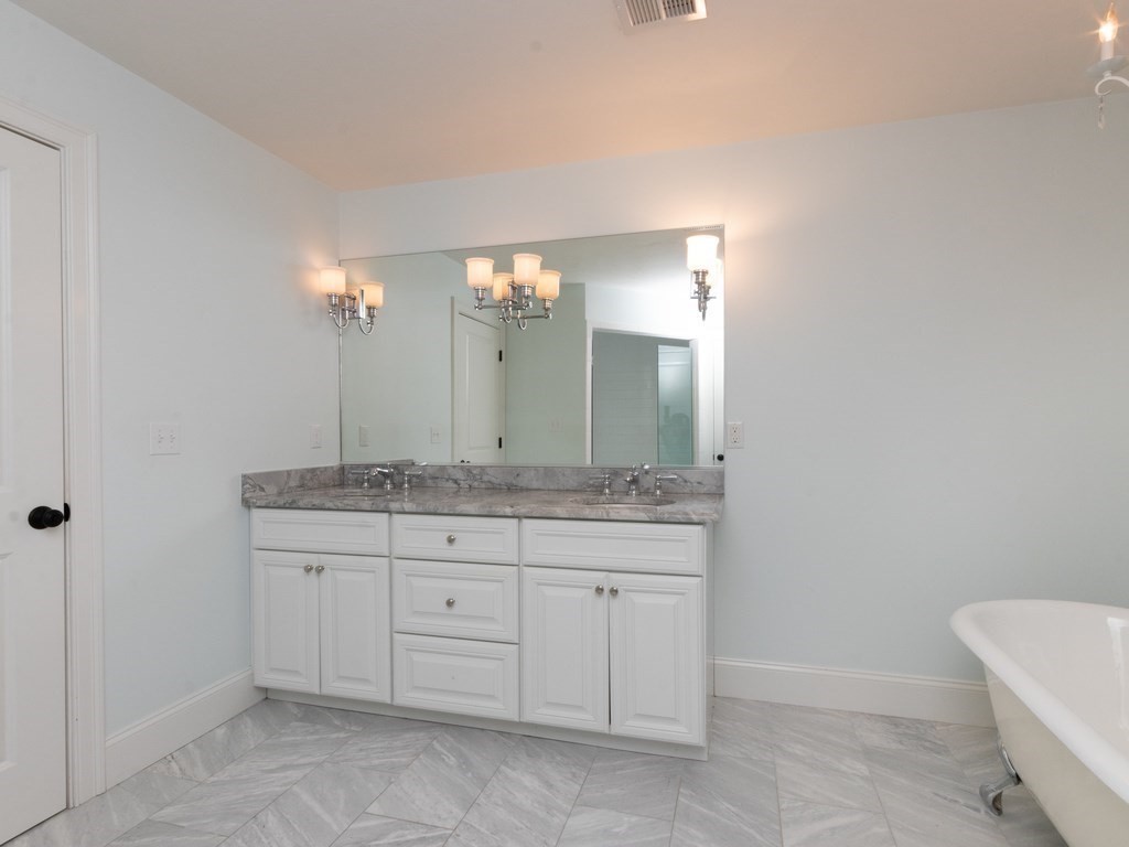 7 Garrett Spillane Road Foxboro, MA 02035 - Photo 24 of 36 a bathroom with a granite countertop sink a toilet and a mirror