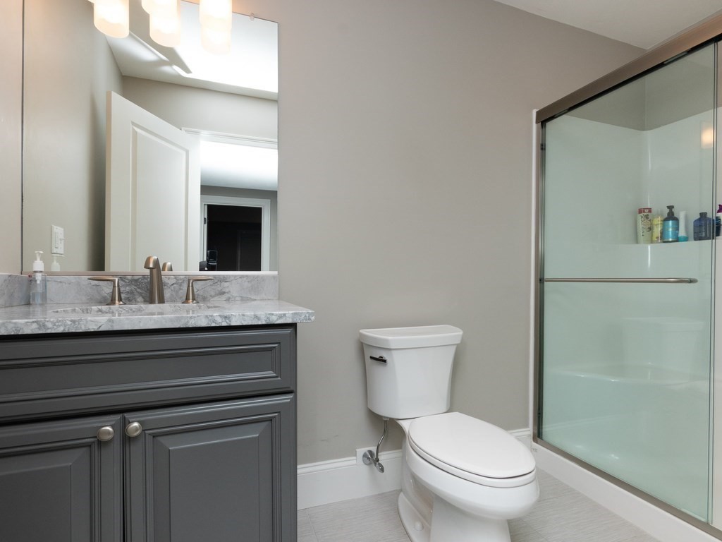 7 Garrett Spillane Road Foxboro, MA 02035 - Photo 28 of 36 a bathroom with a toilet a sink and mirror