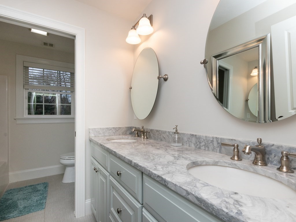 7 Garrett Spillane Road Foxboro, MA 02035 - Photo 33 of 36 a bathroom with a granite countertop double vanity sink and a mirror