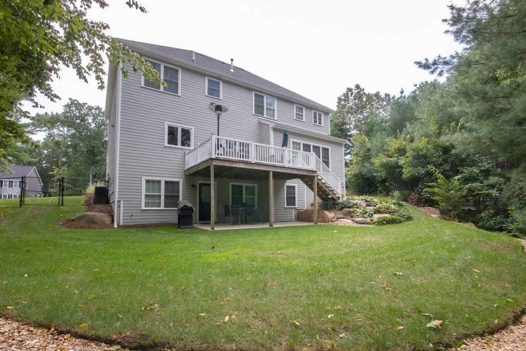 7 Garrett Spillane Road Foxboro, MA 02035 - Photo 34 of 36 a view of a house with a yard and sitting area