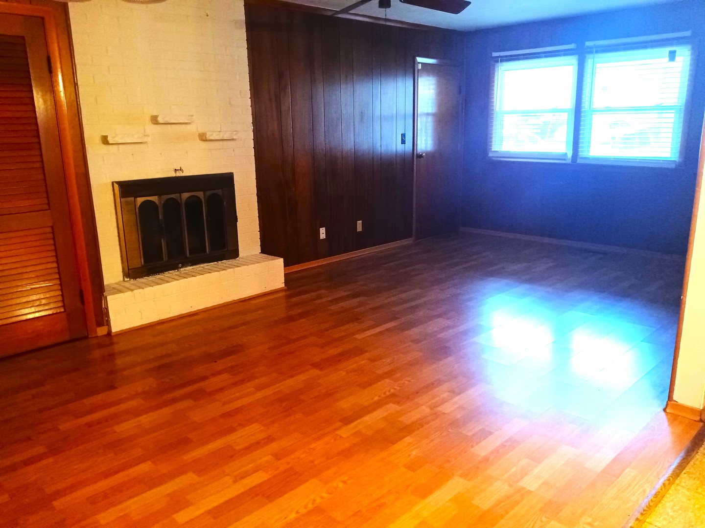 2208 Dale Drive Champaign, IL 61821 - Photo 4 of 12 a view of an empty room with a fireplace and a window