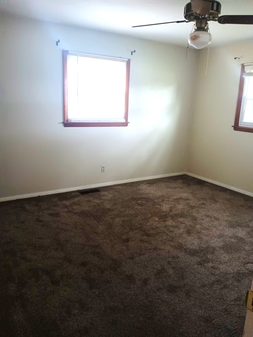 2208 Dale Drive Champaign, IL 61821 - Photo 10 of 12 an empty room with a window