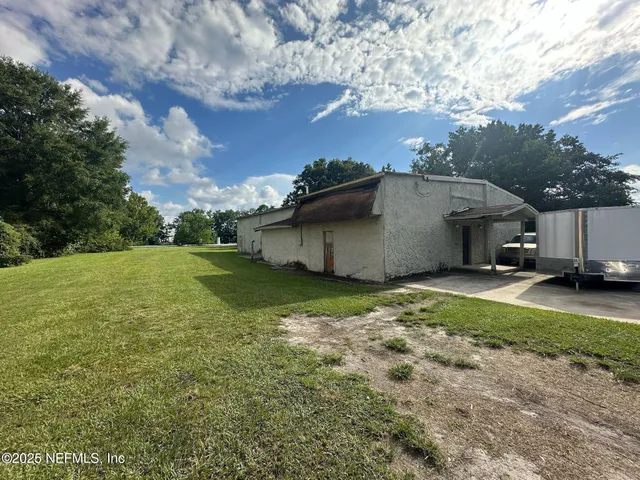 a backyard of a house with lots of green space