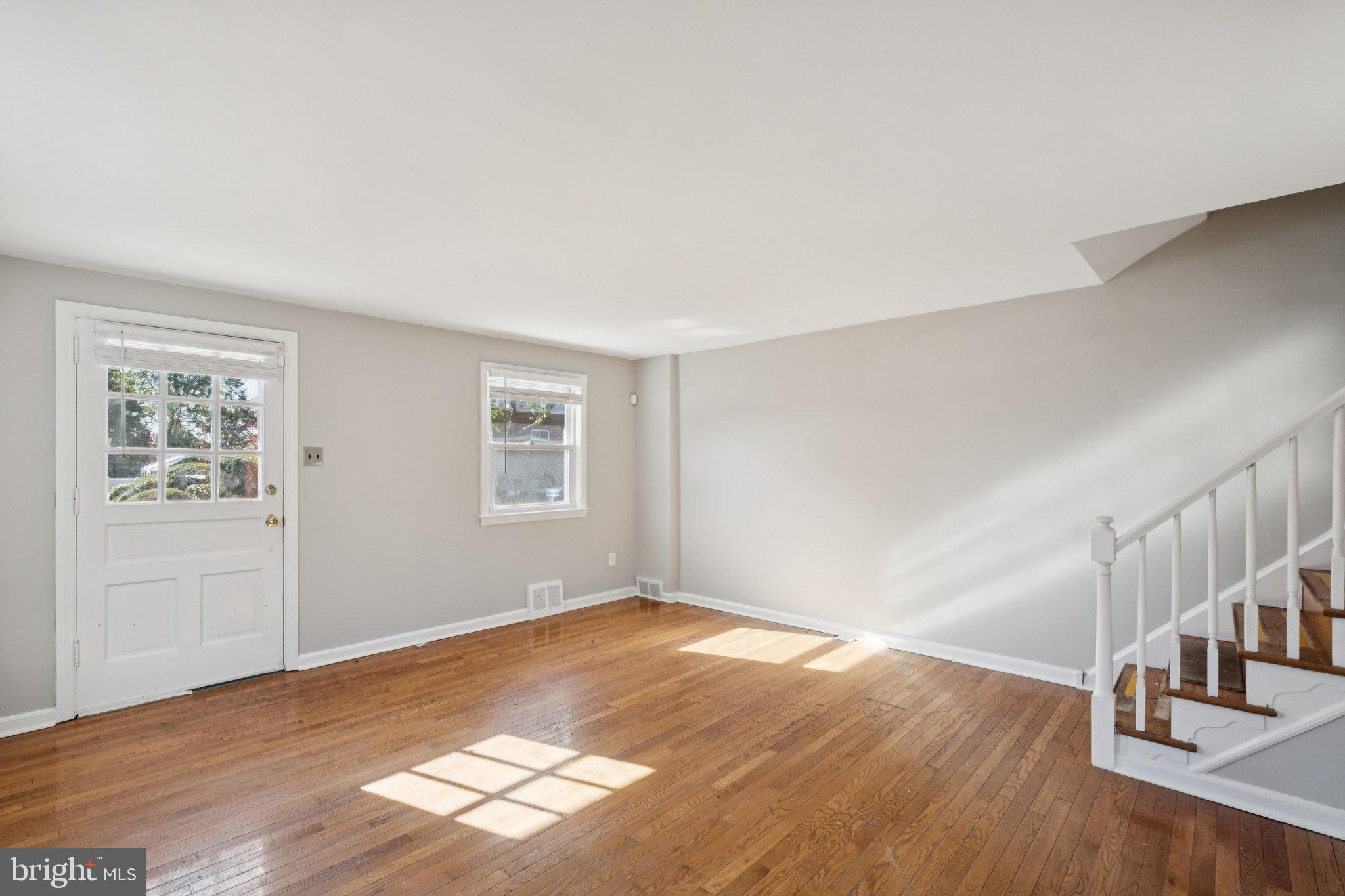 271 Drexel Avenue Lansdowne, PA 19050 - Photo 4 of 27 a view of empty room with wooden floor and fan