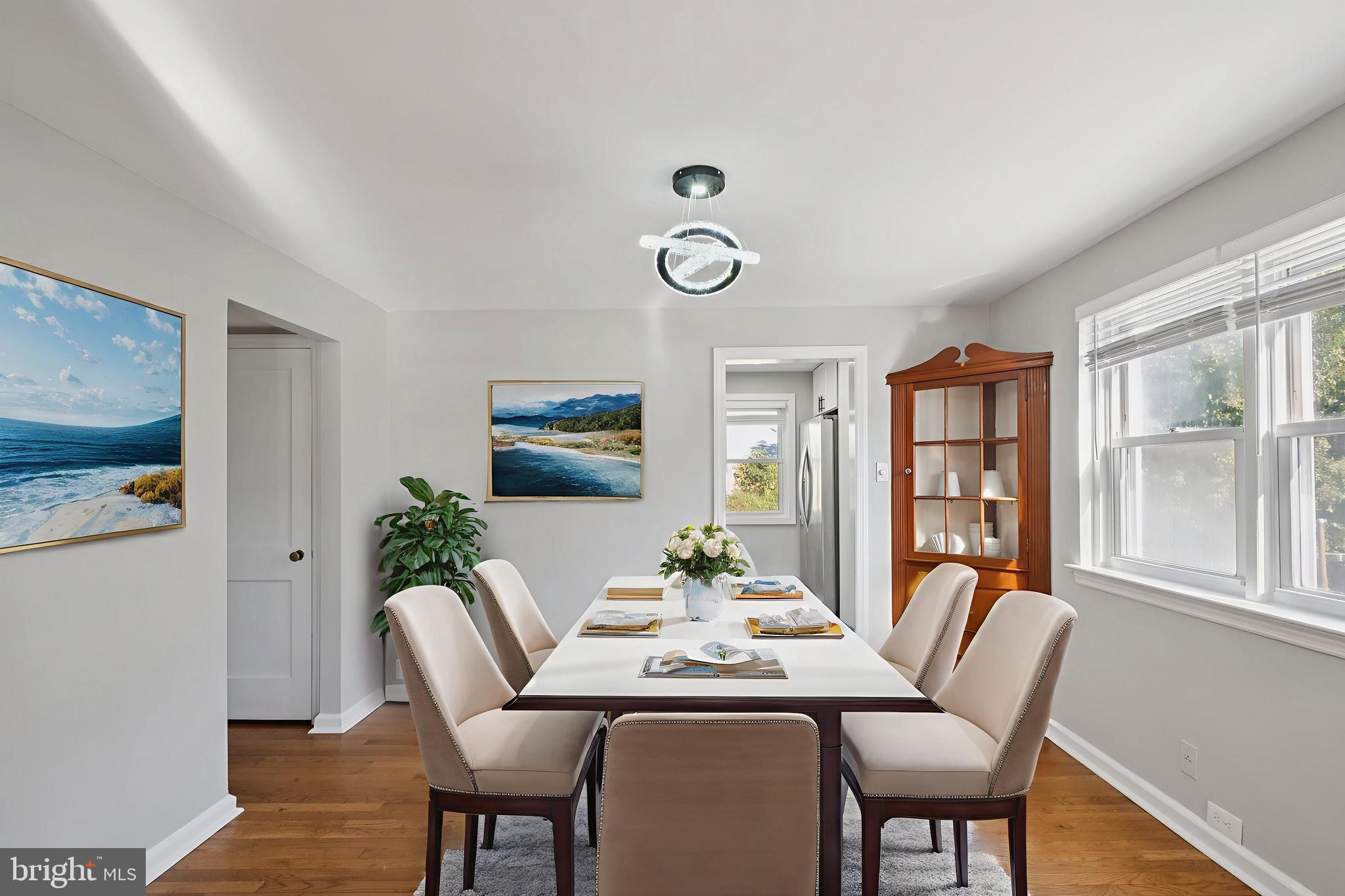 271 Drexel Avenue Lansdowne, PA 19050 - Photo 6 of 27 a dining room with furniture a large window and wooden floor