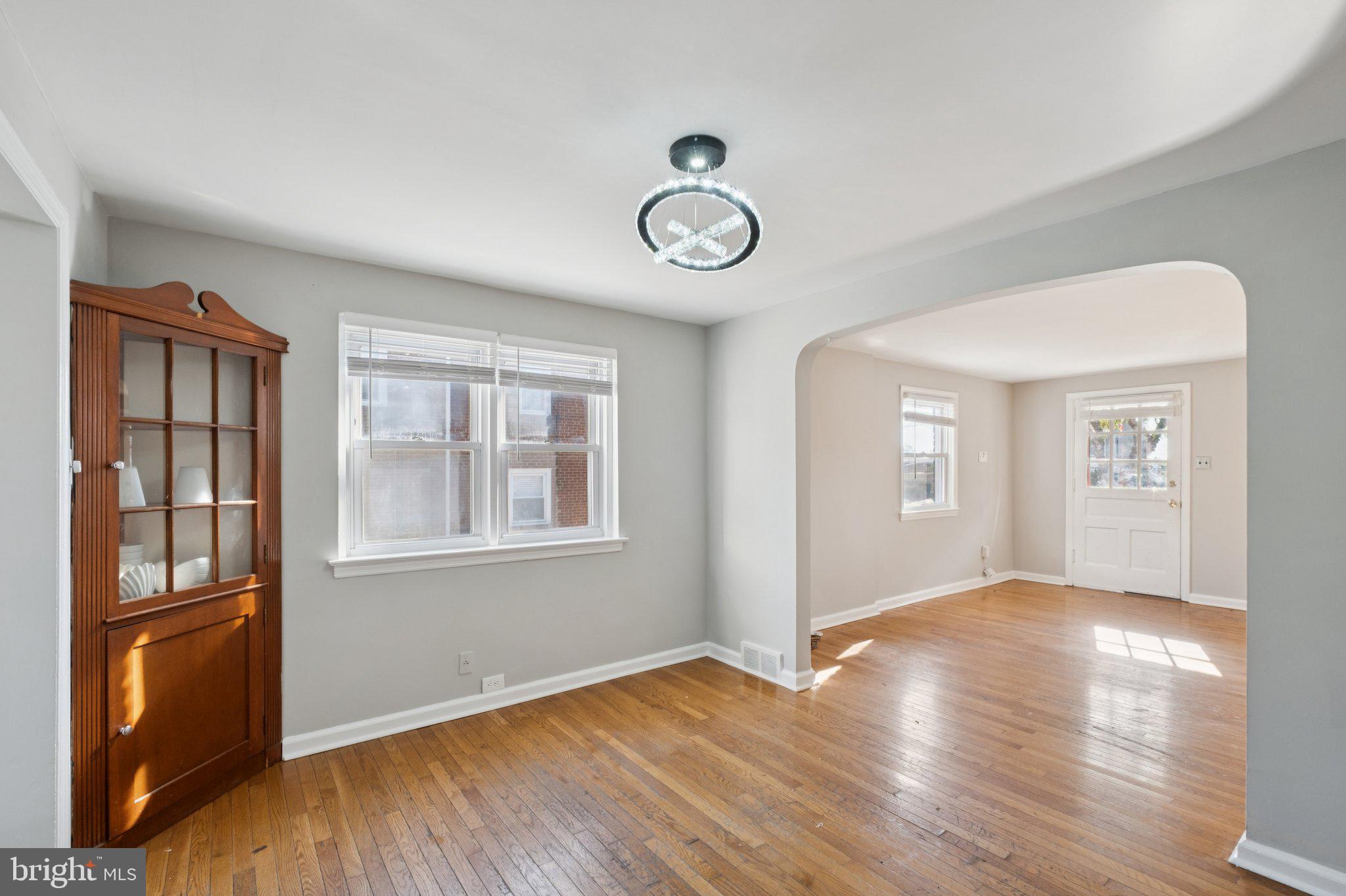 271 Drexel Avenue Lansdowne, PA 19050 - Photo 7 of 27 an empty space with wooden floor and windows