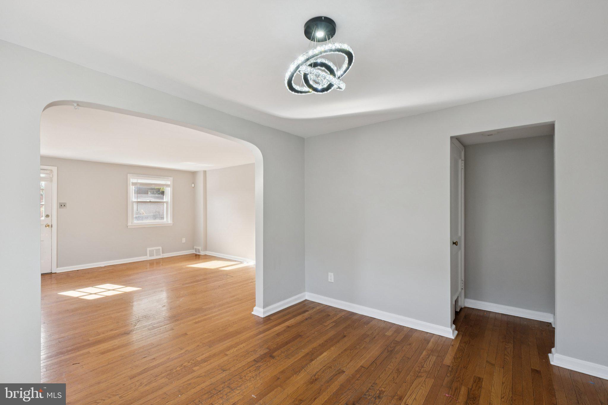 271 Drexel Avenue Lansdowne, PA 19050 - Photo 8 of 27 an empty room with wooden floor and windows