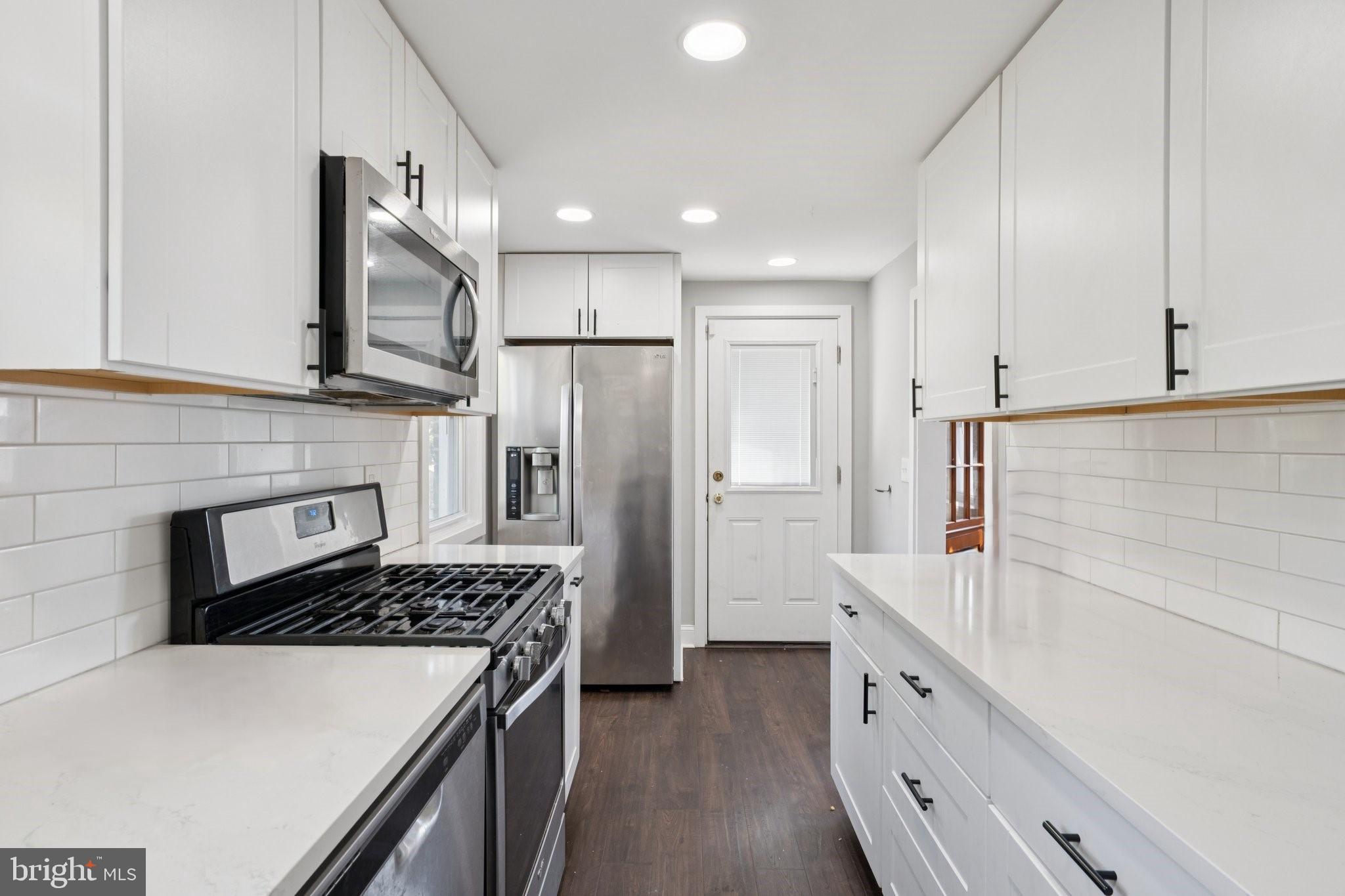 271 Drexel Avenue Lansdowne, PA 19050 - Photo 10 of 27 a kitchen with cabinets and stainless steel appliances