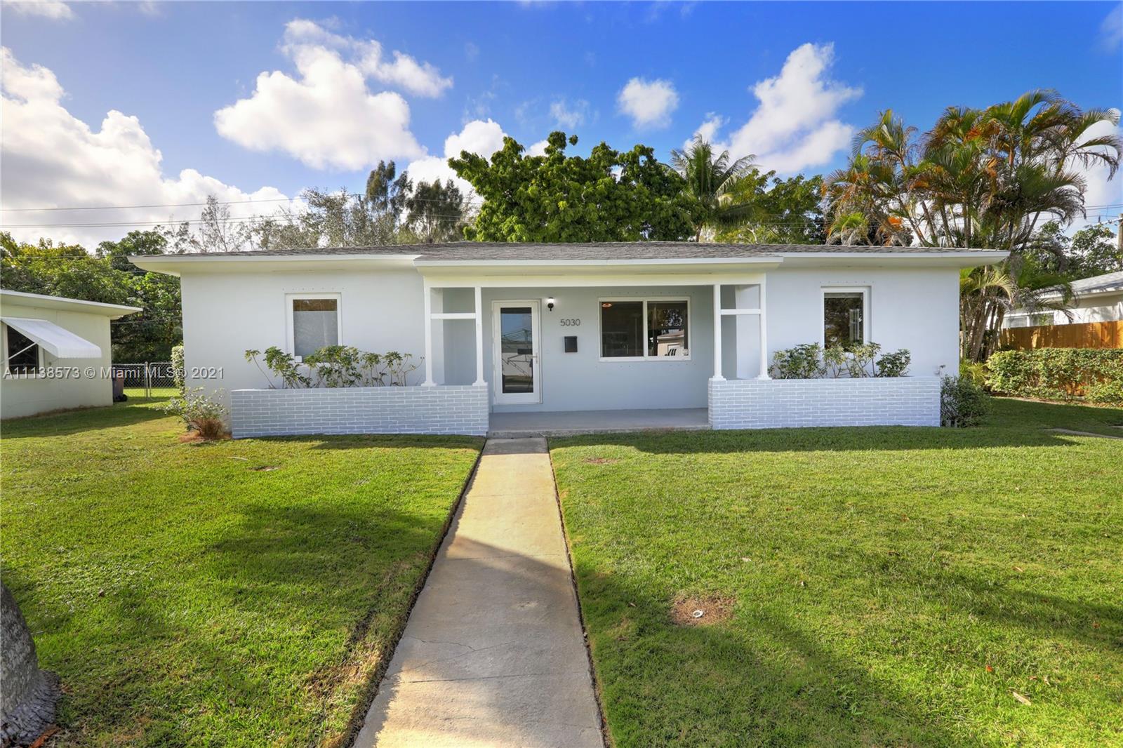 a house view with a garden space