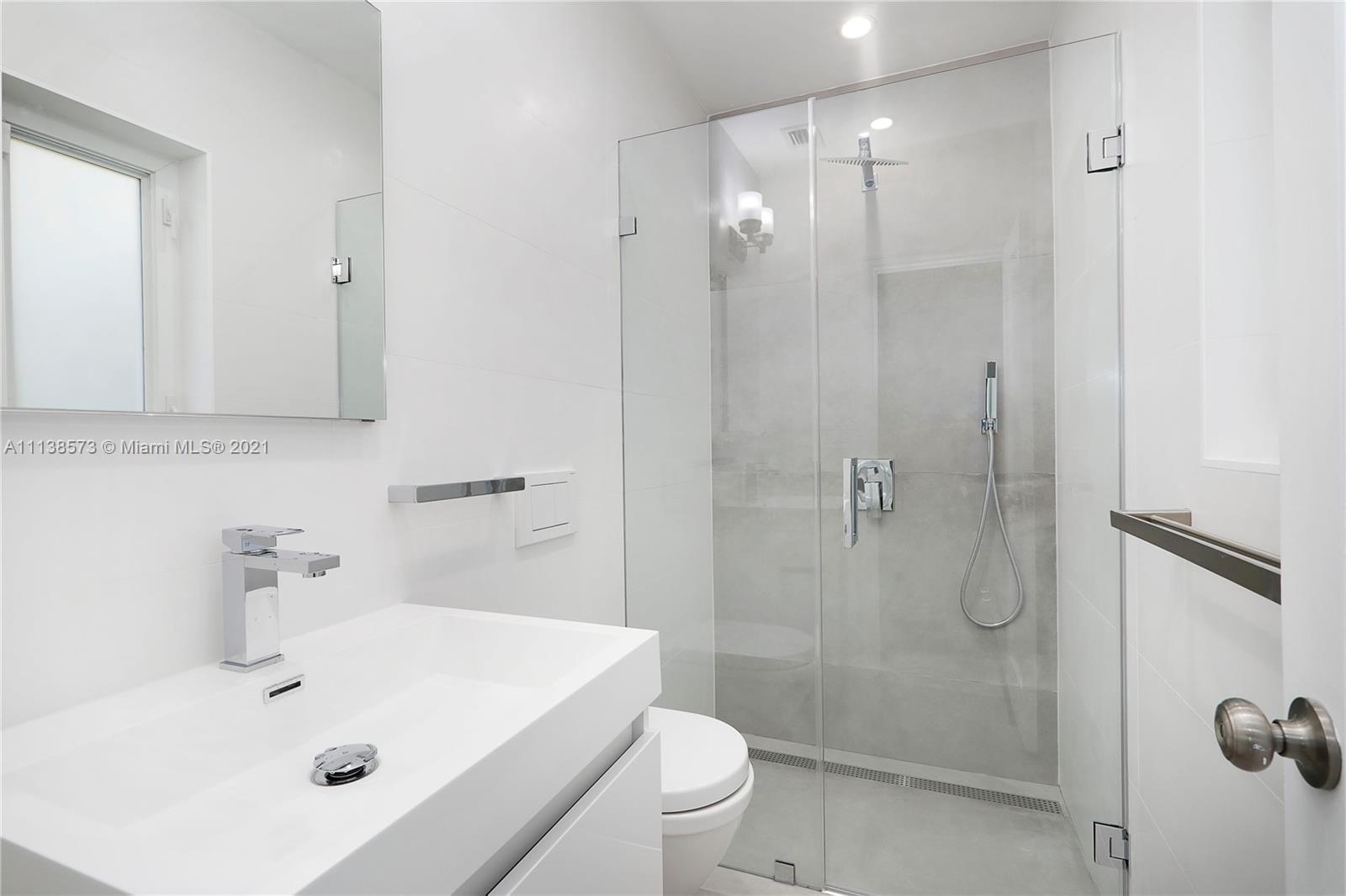 Glenvar Heights Miami, FL 33155 - Photo 17 of 22 a bathroom with a sink a toilet and shower
