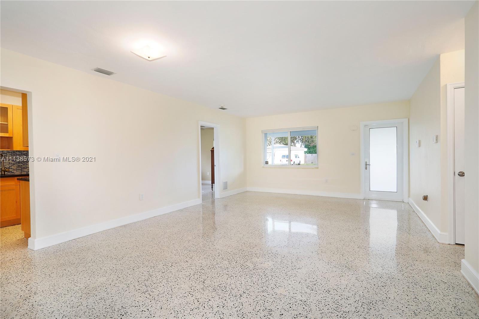Glenvar Heights Miami, FL 33155 - Photo 9 of 22 wooden floor in an empty room with a window