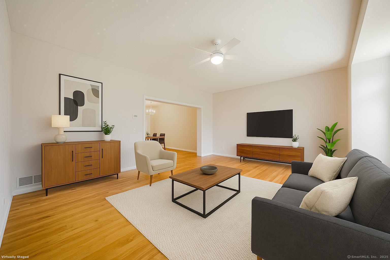 52 Quarry Lane Hamden, CT 06518 - Photo 11 of 29 a living room with furniture and a flat screen tv