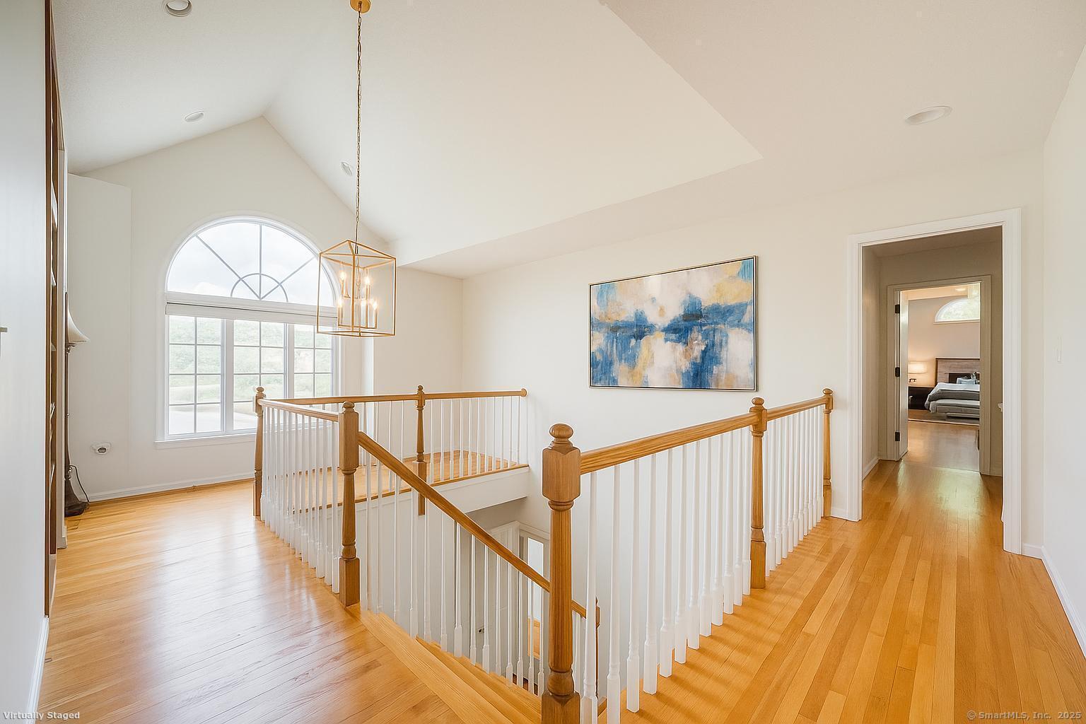 52 Quarry Lane Hamden, CT 06518 - Photo 15 of 29 a view of a hallway with wooden floor and stairs