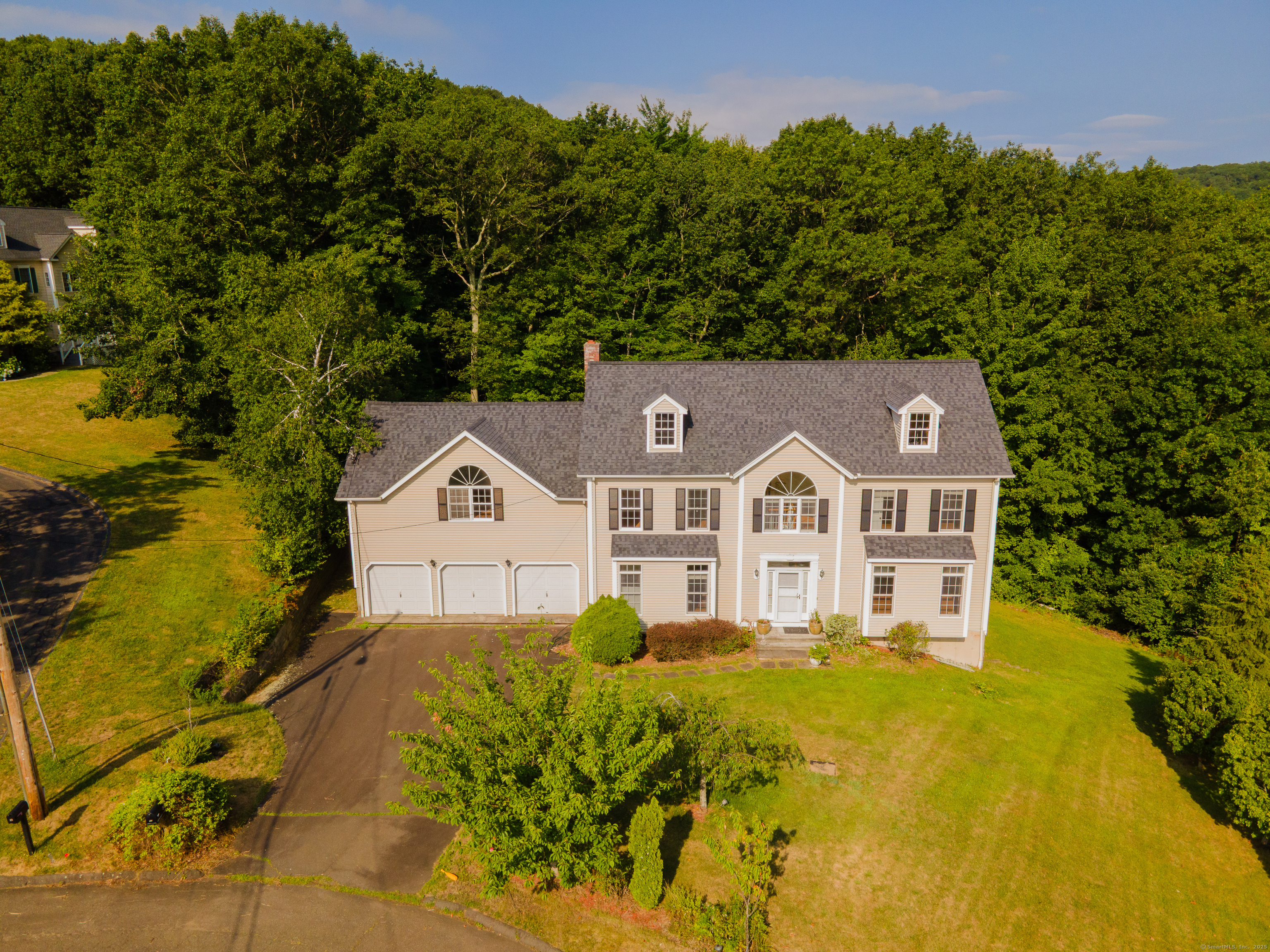 52 Quarry Lane Hamden, CT 06518 - Photo 2 of 29 a view of a big house with a big yard and large trees