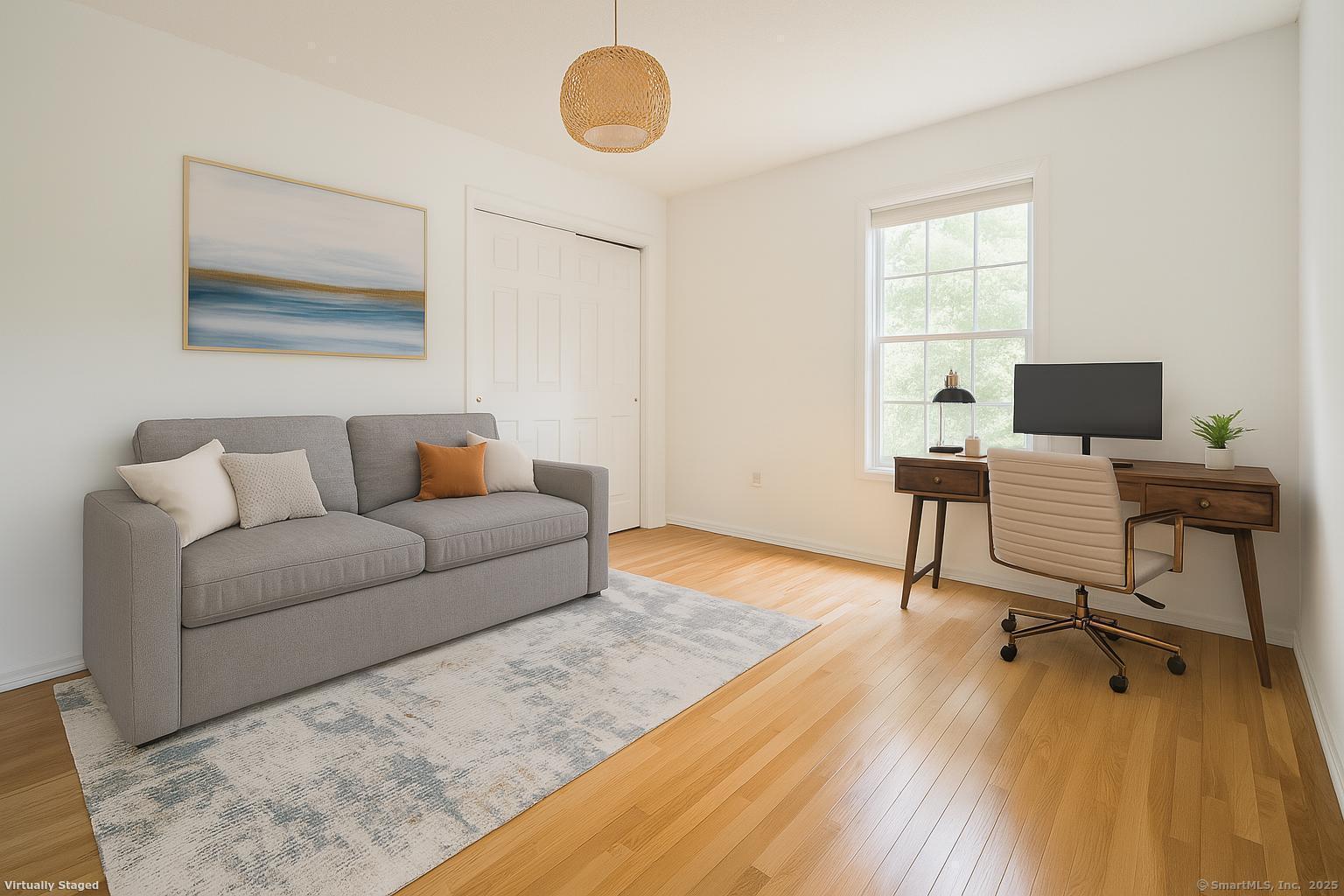 52 Quarry Lane Hamden, CT 06518 - Photo 24 of 29 a living room with furniture and a wooden floor