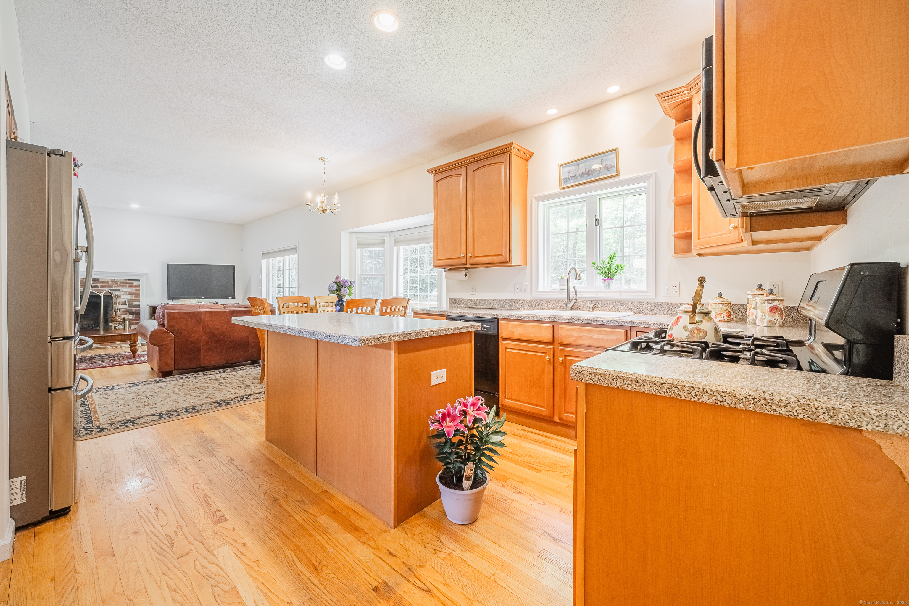 52 Quarry Lane Hamden, CT 06518 - Photo 4 of 29 a kitchen with stainless steel appliances granite countertop a sink stove and refrigerator
