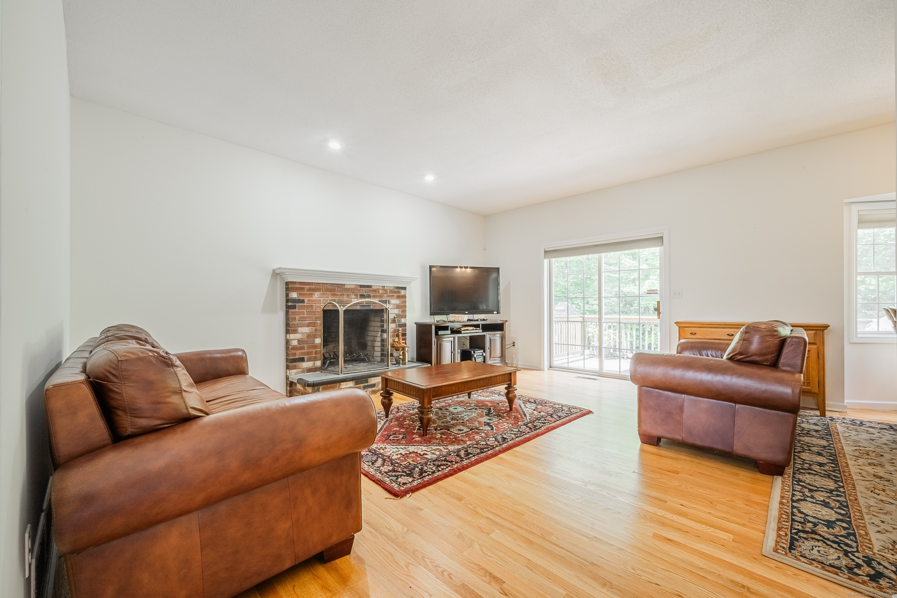 52 Quarry Lane Hamden, CT 06518 - Photo 8 of 29 a living room with furniture or couch and a wooden floor