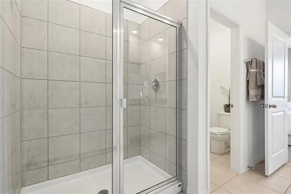 a bathroom with a shower and a toilet