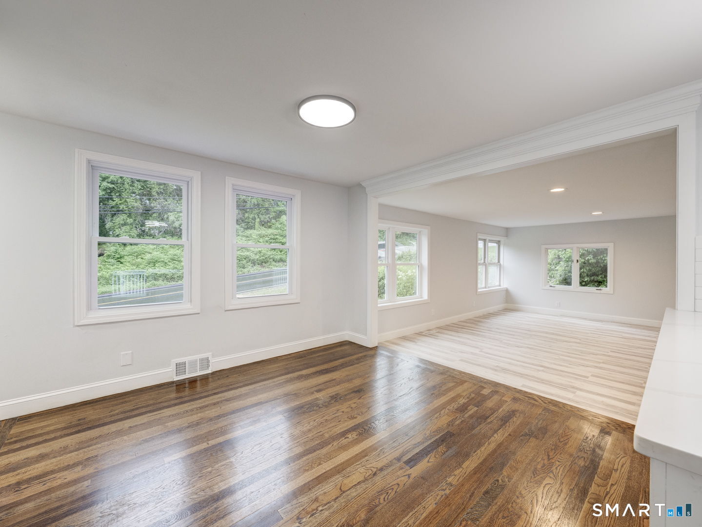 11 Cheshire Road Prospect, CT 06712 - Photo 8 of 38 a view of an empty room with wooden floor and a window