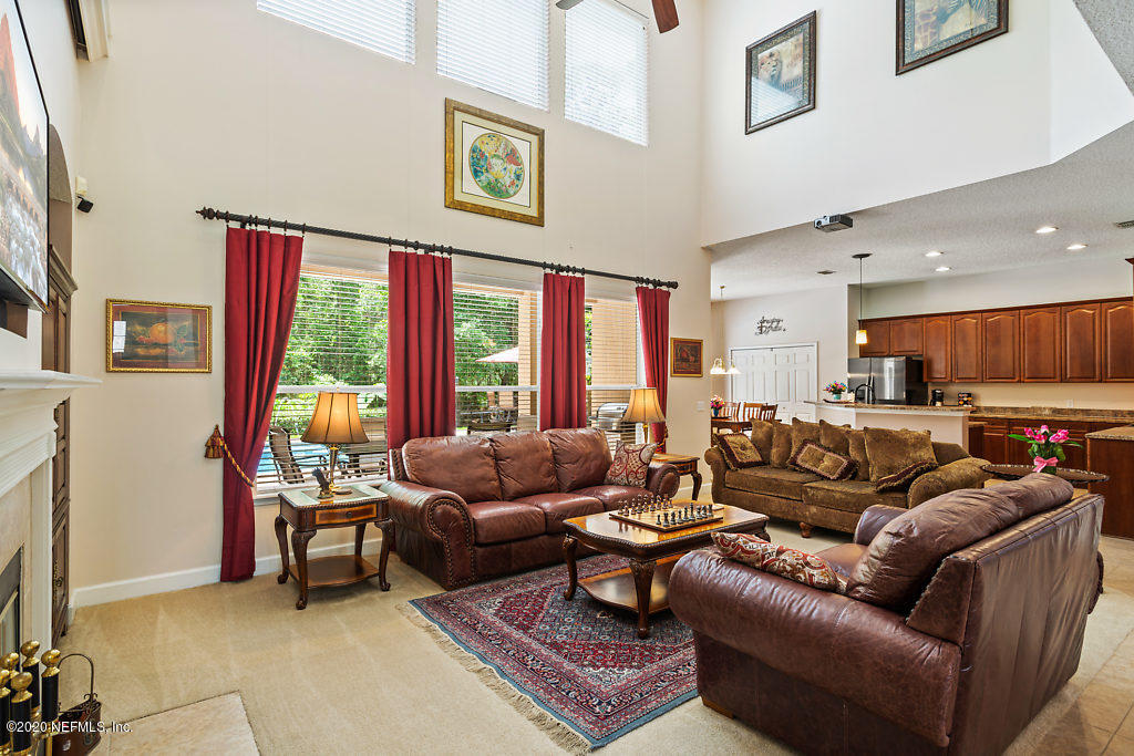 3824 Reds Gait Lane Jacksonville, FL 32223 - Photo 11 of 68 a living room with furniture and a large window