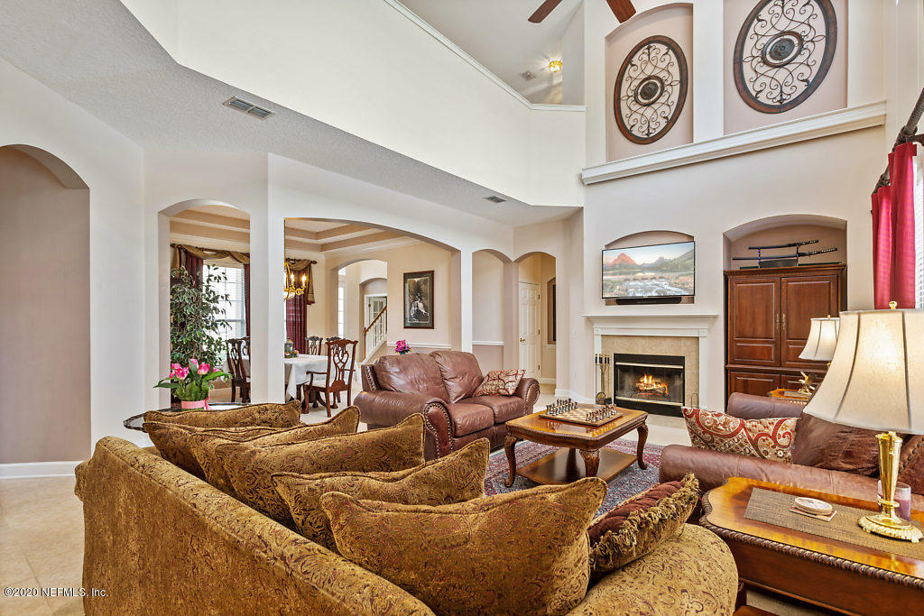3824 Reds Gait Lane Jacksonville, FL 32223 - Photo 13 of 68 a living room with fireplace furniture and a large window