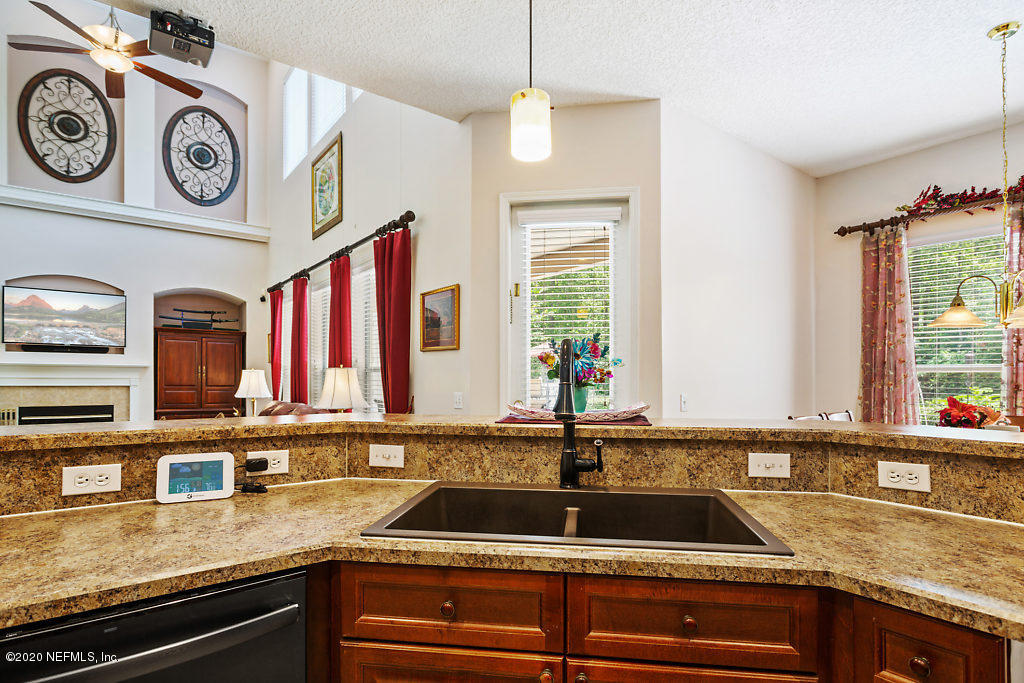 3824 Reds Gait Lane Jacksonville, FL 32223 - Photo 19 of 68 a kitchen with a sink and a stove