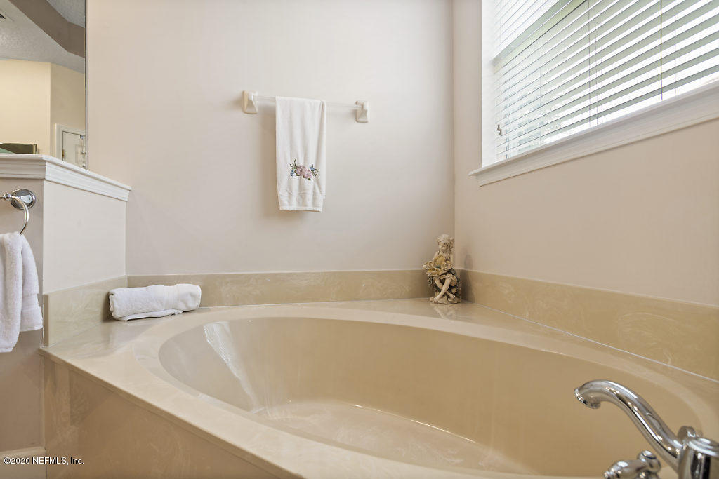 3824 Reds Gait Lane Jacksonville, FL 32223 - Photo 30 of 68 a white bath tub sitting next to a window