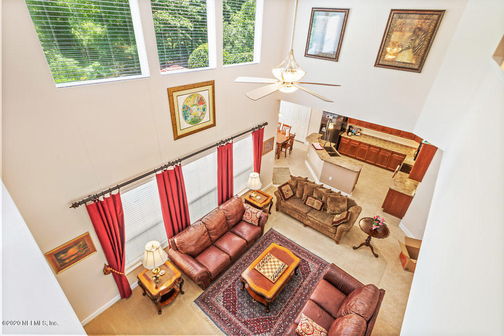 3824 Reds Gait Lane Jacksonville, FL 32223 - Photo 35 of 68 a view of a living room with furniture and a floor to ceiling window