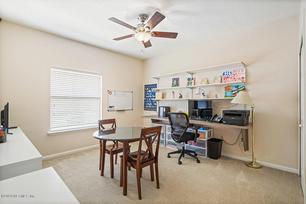 3824 Reds Gait Lane Jacksonville, FL 32223 - Photo 41 of 68 a view of a workspace with furniture and a window