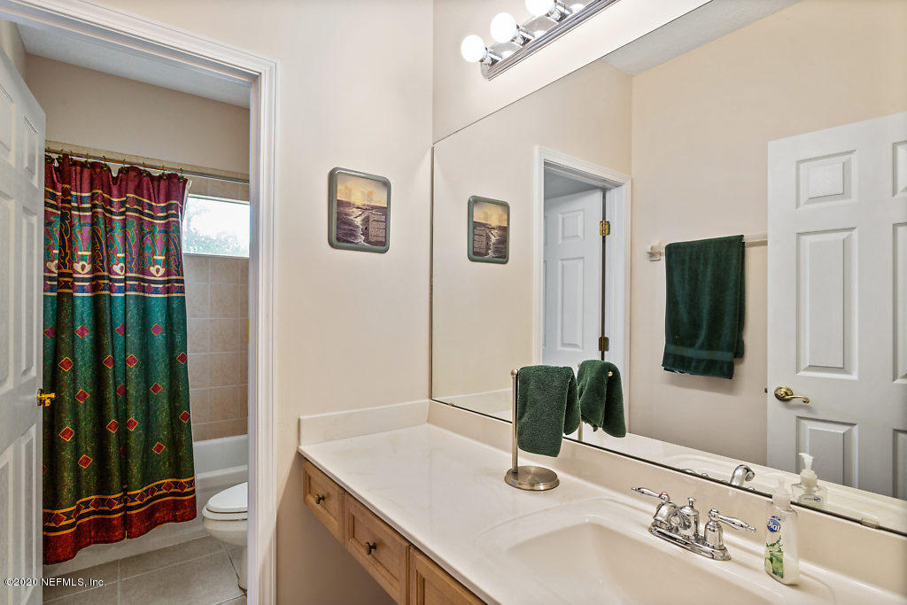 3824 Reds Gait Lane Jacksonville, FL 32223 - Photo 45 of 68 a bathroom with a sink and a mirror