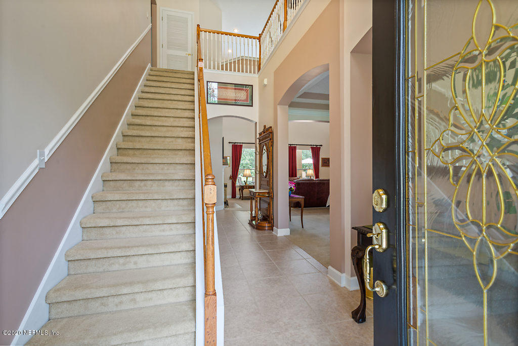 3824 Reds Gait Lane Jacksonville, FL 32223 - Photo 5 of 68 a view of entryway and hall with wooden floor