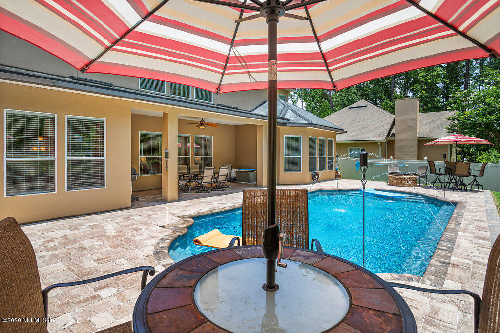 3824 Reds Gait Lane Jacksonville, FL 32223 - Photo 57 of 68 a backyard of a house with yard and outdoor seating