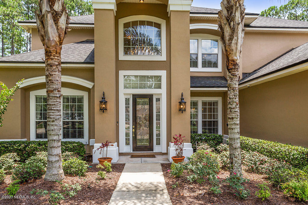 3824 Reds Gait Lane Jacksonville, FL 32223 - Photo 63 of 68 front view of a brick house with a large windows
